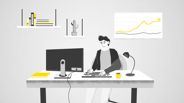 A man sits at a desk looking for information about ERDF